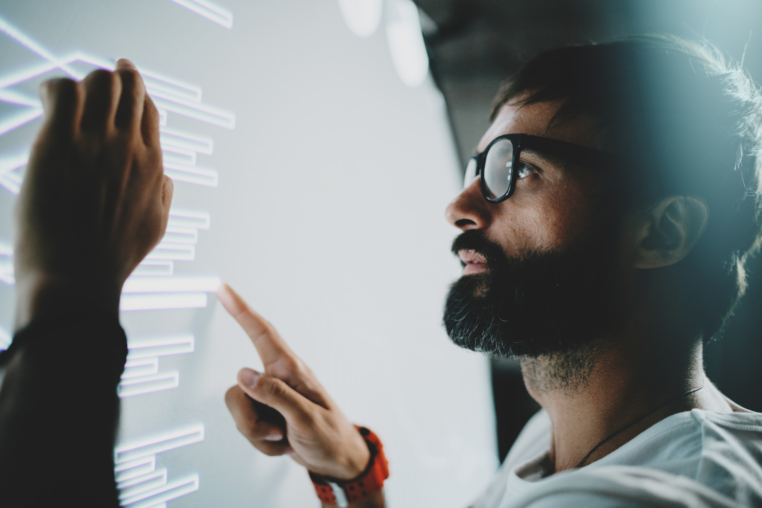 Concept of Virtual Panel Displaydiagramdigital Graph Interfacesyoung Bearded Man Touching Virtual Panel with Graphsblurred Background Horizontal